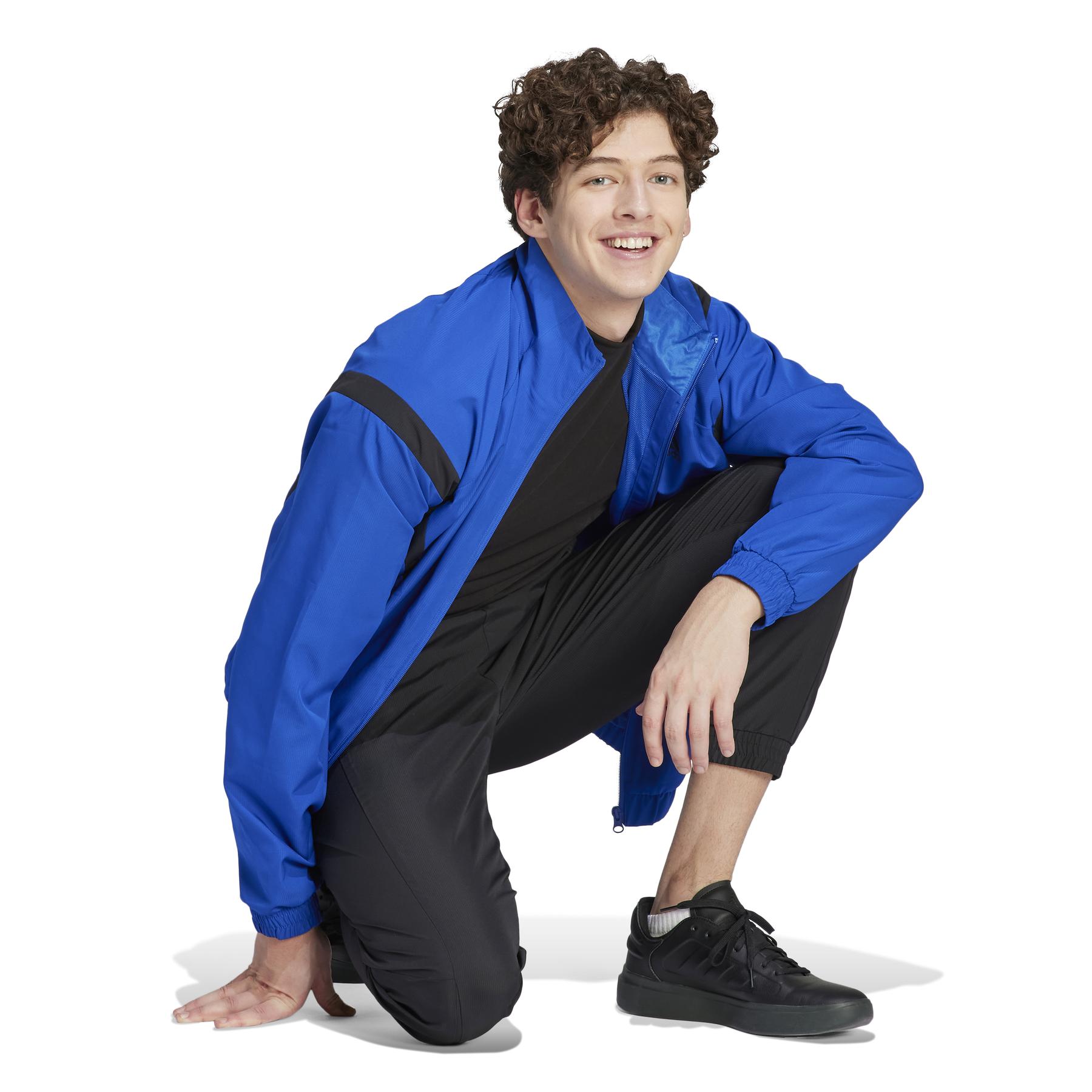 product/a/d/adidas_ij6070_7_apparel_on_model_walking_view_white_bv.jpg